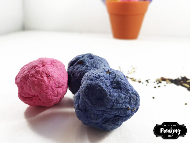 Quick and easy steps to make your own colorful seed bombs to throw and grow wild flowers. Great Earth Day crafts for kids and wedding favors.