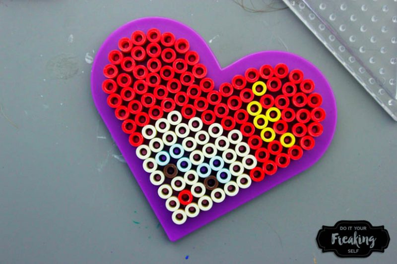 DIY Queen of Hearts Magnets inspired by Disney's Alice in Wonderland. Perler Bead patterns and ideas for your next craft project.
