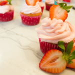 Cute Strawberry Lemonade Cupcakes are the perfect addition to a summer brunch or cook out! Tangy, sweet and easy to make! No one will know they're from a box mix!