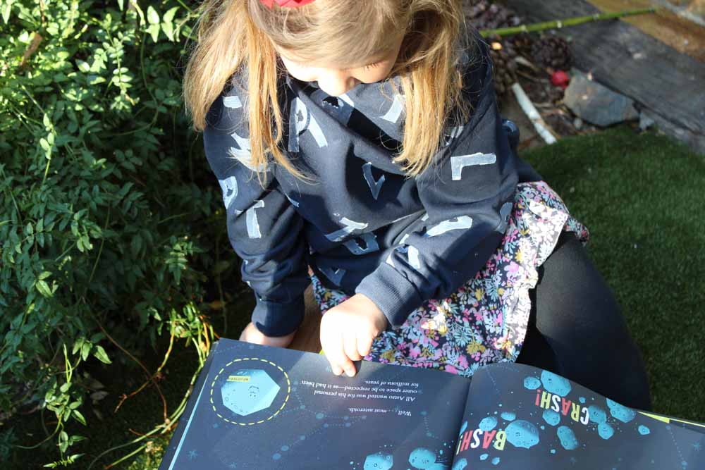 Create a hooded sweatshirt for the little book lover in your life! This Matilda Wormwood inspired hoodie is perfect for snuggling up with a good book! | Roald Dahl Day | Costume | Easy Halloween | Potato Stamp | Kids Projects - Do It Your Freaking Self