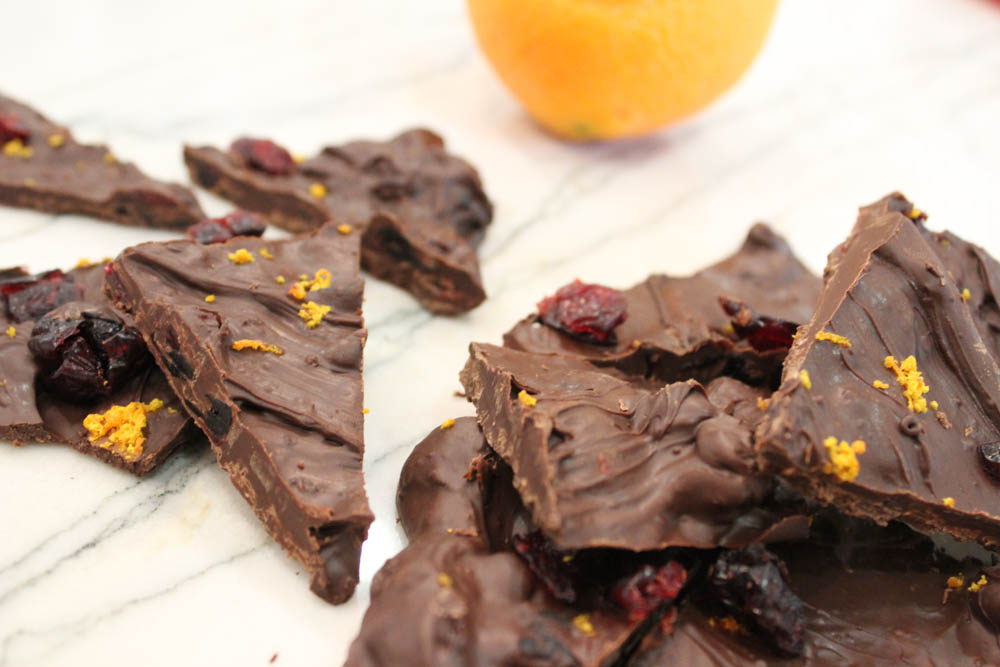 Set your tastebuds alight with this spiced dark chocolate orange cranberry bark! Great for holiday parties, desserts, and gifts. | Dark Chocolate | Holiday Desserts | Orange Zest | Dried Fruit | Edible Gifts | Easy Bark | Do It Your Freaking Self