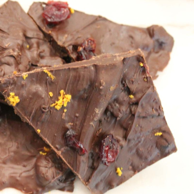 Set your tastebuds alight with this spiced dark chocolate orange cranberry bark! Great for holiday parties, desserts, and gifts. | Dark Chocolate | Holiday Desserts | Orange Zest | Dried Fruit | Edible Gifts | Easy Bark | Do It Your Freaking Self