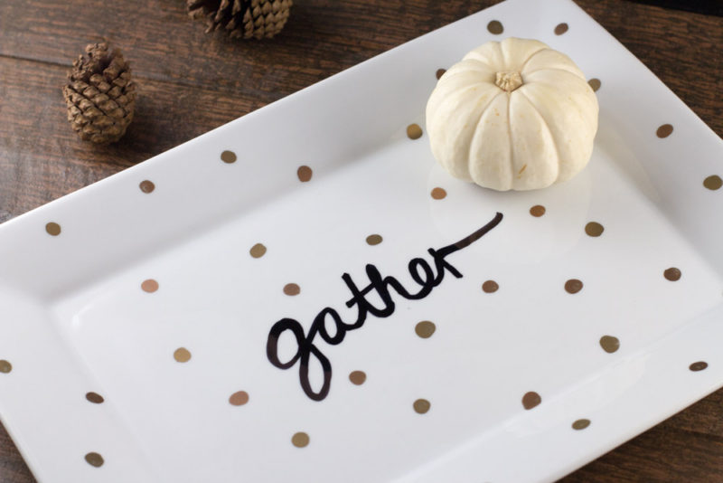 Decorate a ceramic plate with this easy DIY Sharpie plate tutorial for your next gathering. A different take on the sharpie mug, this plate looks great on your table or as a centerpiece.