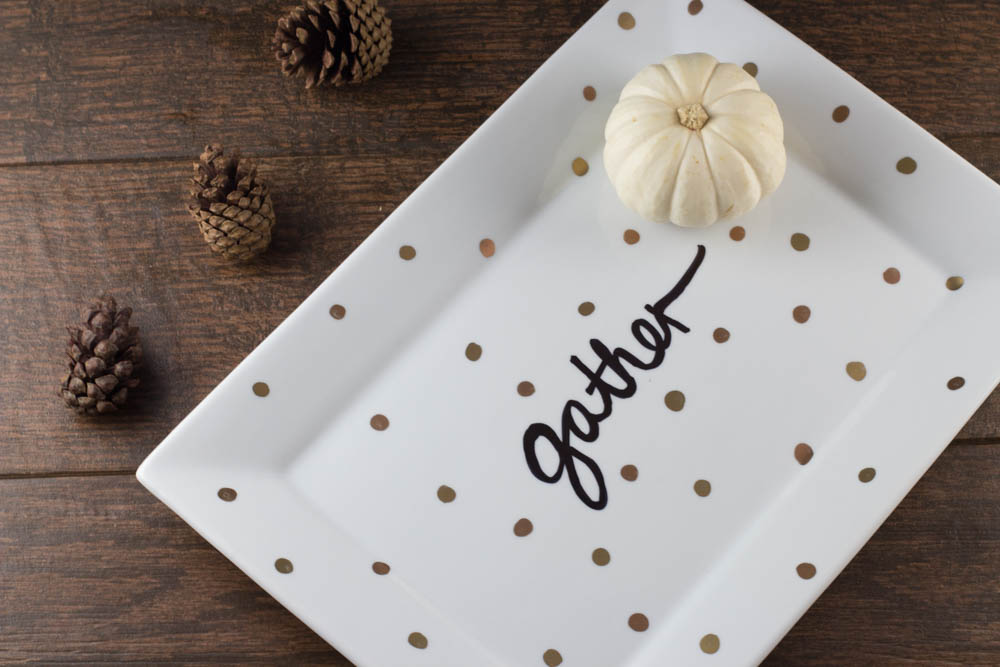 Decorate a ceramic plate with this easy DIY Sharpie plate tutorial for your next gathering. A different take on the sharpie mug, this plate looks great on your table or as a centerpiece.