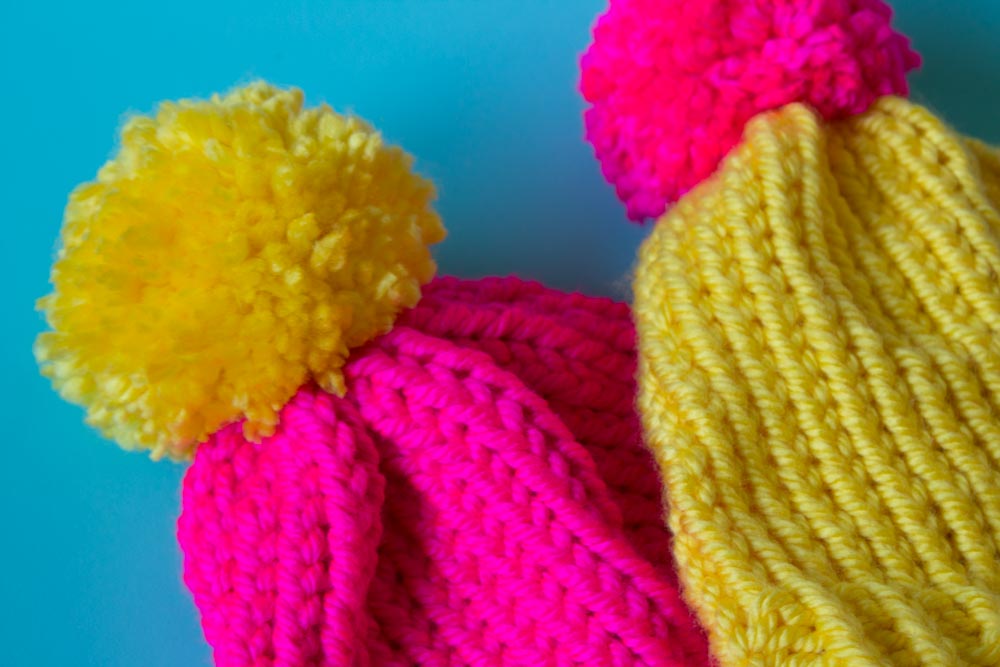 Need a last minute hat? Create a simple loom knit hat in just a few hours! Complete with giant pom pom! A great gift or beginner project! - Free pattern | Tutorial | with brim | winter hats | loom knit projects - Do It Your Freaking Self