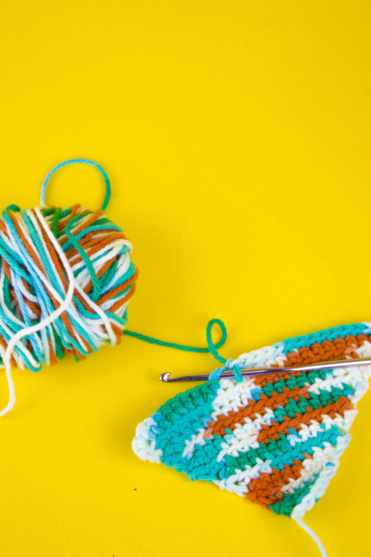 Spruce up your kitchen or give a useful gift with a bright and colorful reusable crochet dishcloth! A great project for beginner to intermediate skills.