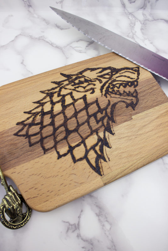 Create your own wood burned Game of Thrones Cutting Board with this easy tutorial. If you've ever wanted to try wood burning, this is a fun project to get you started!