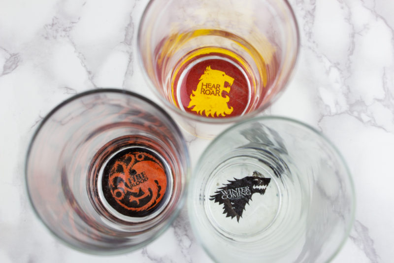 Show your Game of Thrones pride with some easy custom DIY Game of Thrones House Sigil Glasses. Represent your favorite houses and drink up!