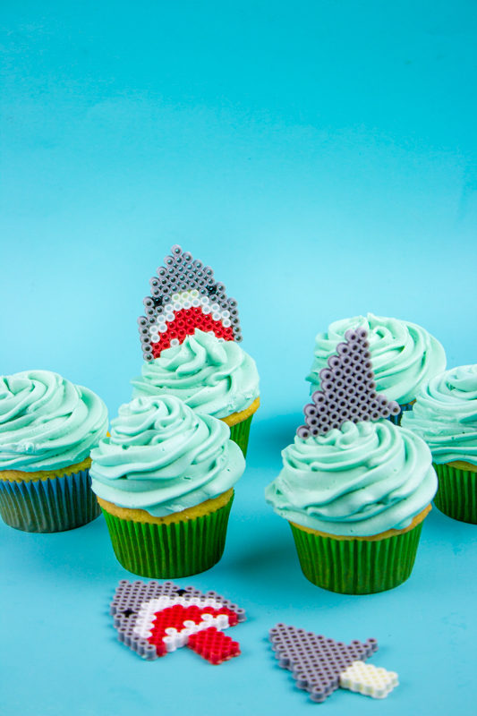 Kick off your Shark Week or Sharknado festivities with some kid friendly Perler Bead Shark Cupcake Toppers! You know you want to! 