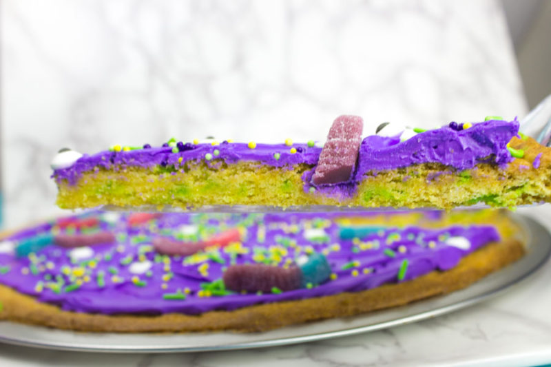 This cake mix monster cookie cake is super simple and a fun project to make for all of your Halloween parties! This giant sugar cookie is definitely an adorable crowd pleaser!