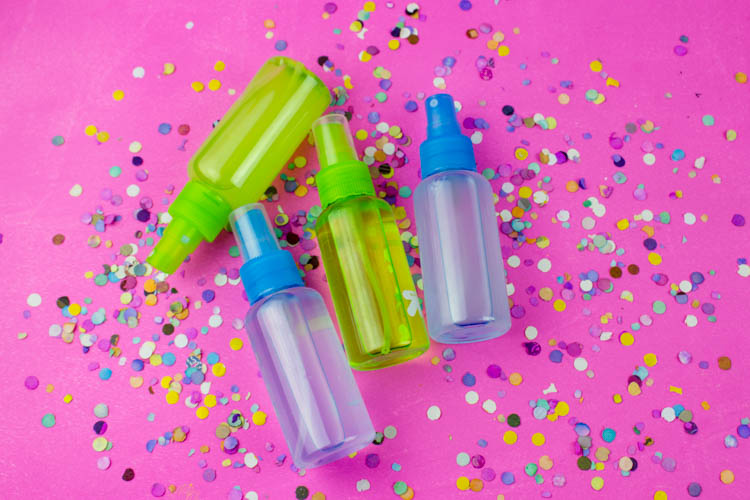 Keep germs away with this DIY Hand Sanitizer Spray and these fun colorful labels! Use your favorite essential oils for a fun seasonal gift! | Do It Your Freaking Self | #DIYHandSanitizer #wellness #essentialOils