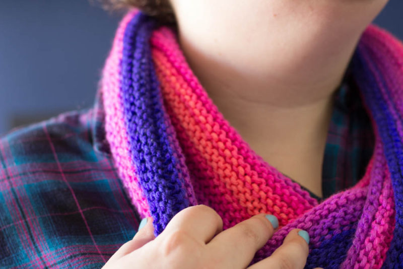 Knit with straight needles, this knit gradient cowl scarf is perfect for beginner knitters learning new stitches. Grab your favorite yarn and get knitting!