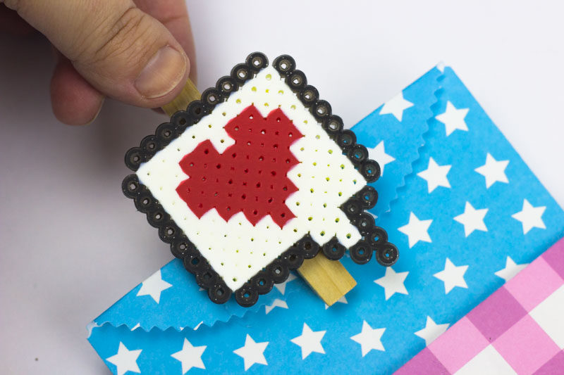DIY Valentines Bag Clips are a fun and engaging way to add charm and festive touches to your kitchen organization efforts! | #perlerbead #pattern #valentinescrafts