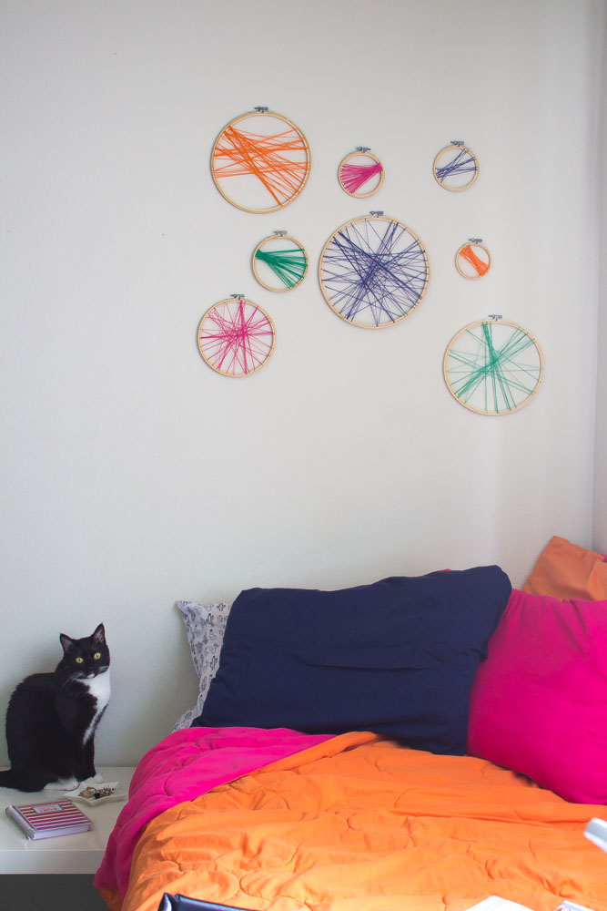 Learn how to DIY your own colorful boho headboard using embroidery hoops and your favorite colors!